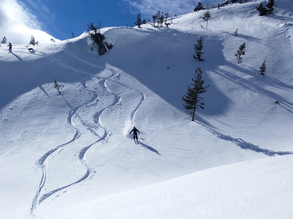 Carving fresh turns on the way down