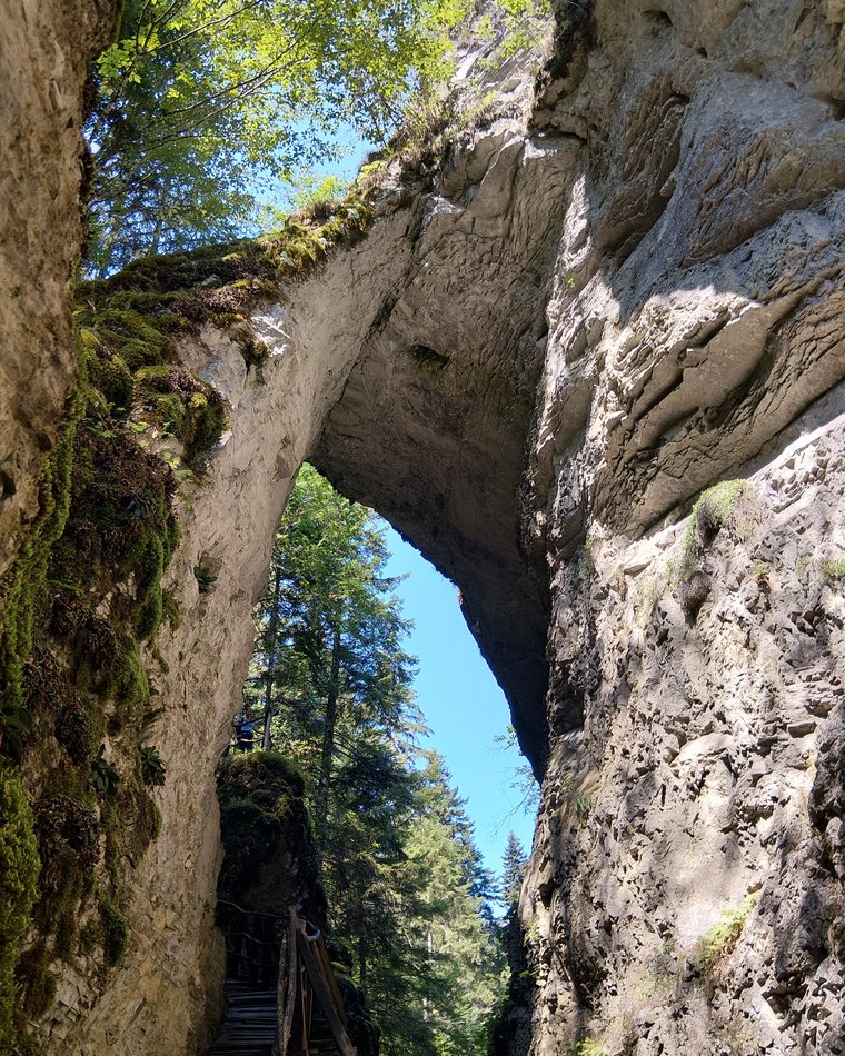 A natural rock arch over a slot canyon in the Rhodope mountains